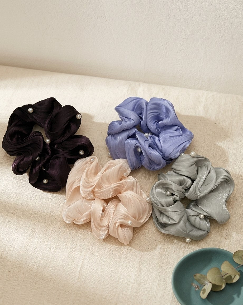 Pearl satin scrunchie set on a cream linen table