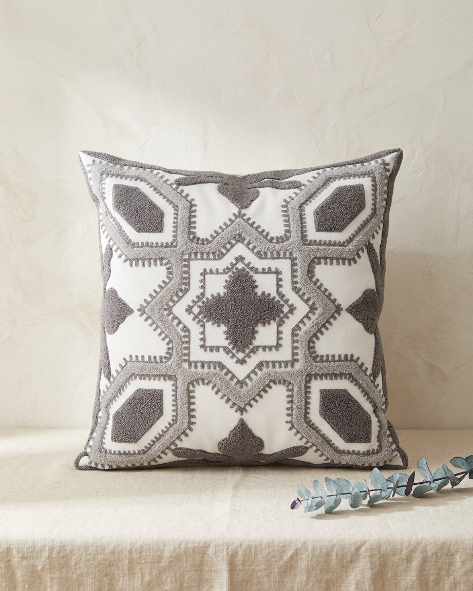 Moroccan tufted cushion cover on a cream linen table